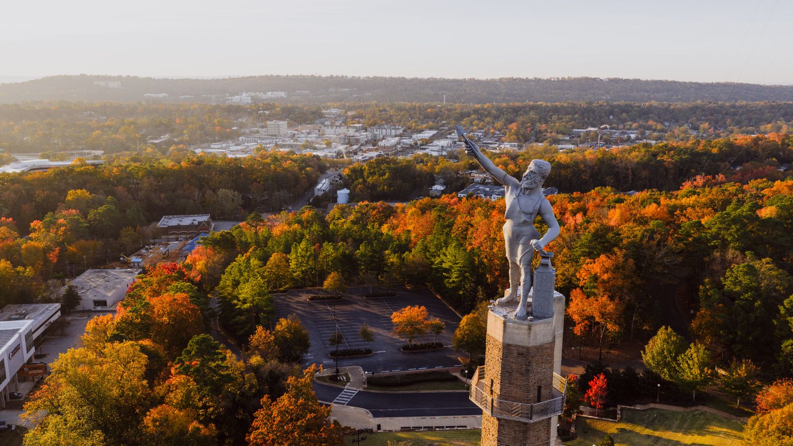 The Vulcan statue on Red Mountain above fall foliage, overlooking metro Birmingham, Alabama